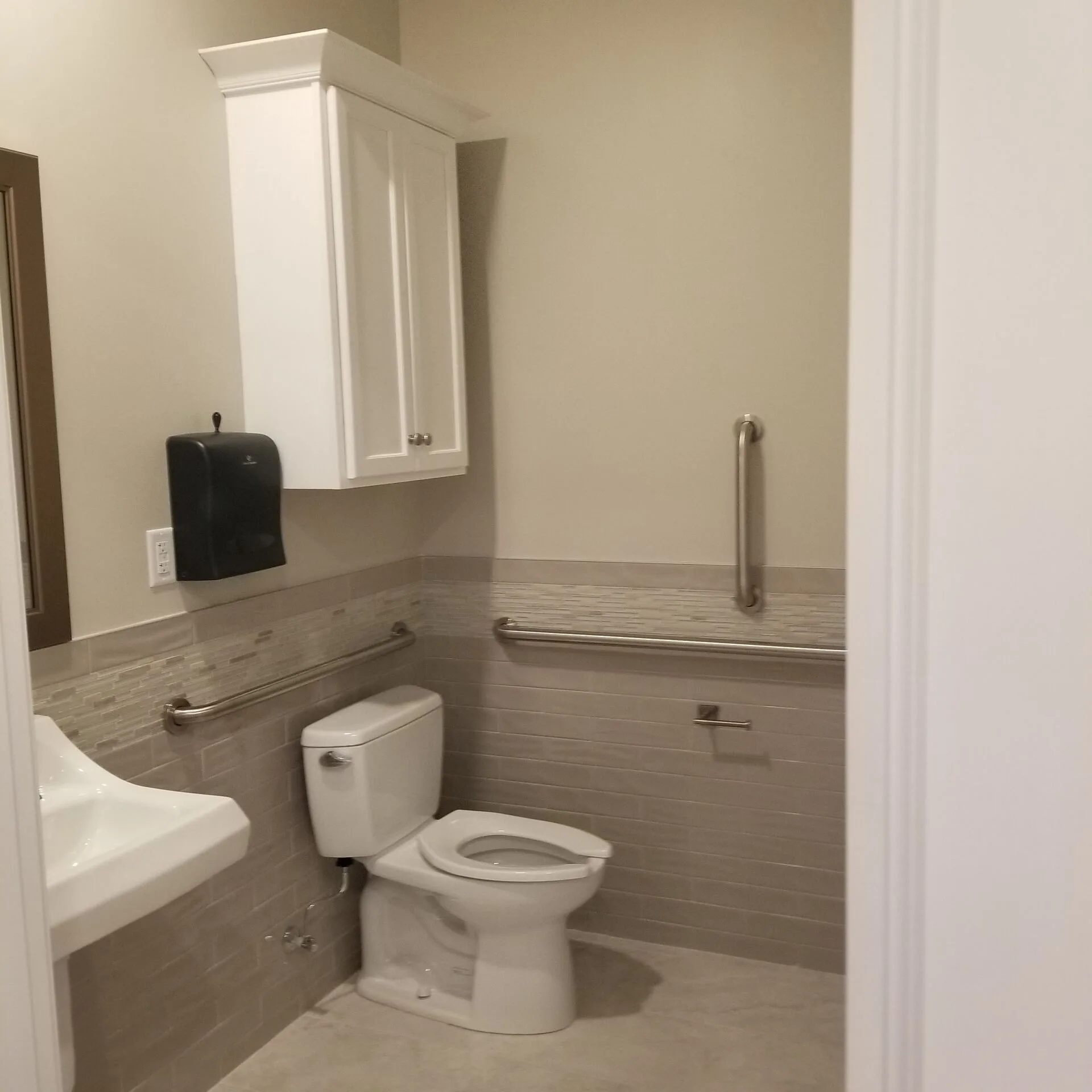 Hallway view toward entry doors