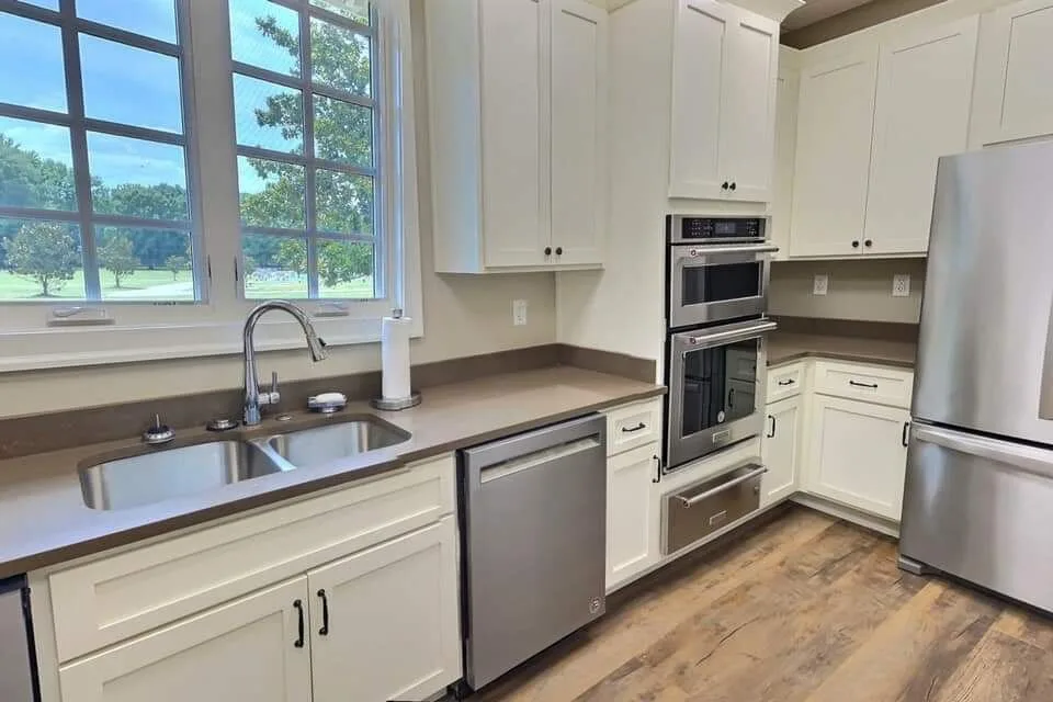 Kitchen detail — double wall ovens and stainless refrigeration