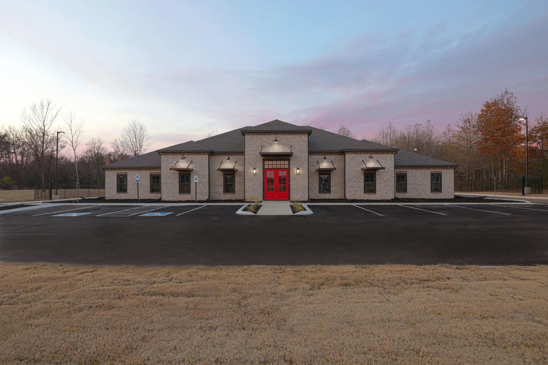 Corporate office and warehouse exterior at twilight — mixed-use commercial campus by Harber Built